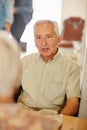 They still love coffee and conversation. a smiling senior couple taking together in a cafe. Royalty Free Stock Photo