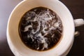 Still milk marbling in unstirred coffee. Royalty Free Stock Photo