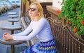 Still waiting him. Woman sits alone cafe terrace urban background defocused. Girl sit alone cafe waiting him. Woman Royalty Free Stock Photo