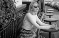 Still waiting him. Woman sits alone cafe terrace urban background defocused. Girl sit alone cafe waiting him. Woman Royalty Free Stock Photo