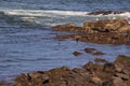 Rising tide as waves crash on rocky shoreline