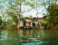 Stilt houses above river in rural Thailand. Royalty Free Stock Photo