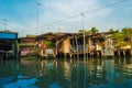 Stilt houses above river in rural Thailand. Royalty Free Stock Photo