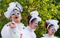 Stilt walker fairy sends a kiss to the public