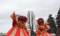 Stilt-walkers in funny colorful costumes pose for a photography during Shrovetide celebrations in Kyiv