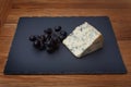 Stilton Blue Cheese with Sable Grapes Royalty Free Stock Photo