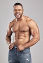 Stimulate dont annihilate. Studio shot of a young muscular man posing against a grey background. Royalty Free Stock Photo
