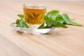 Stinging nettle tea on wooden flooring Royalty Free Stock Photo
