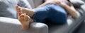 Stinky Feet Resting On Couch. Foot Smell Royalty Free Stock Photo