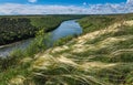 Stipa (green feather grass) in a hills, bend of the river. Royalty Free Stock Photo