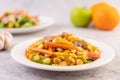 Stir the corn and carrots, put the pork on the plate on the wooden plate Royalty Free Stock Photo