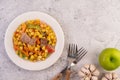 Stir the corn and carrots, put the pork on the plate on the wooden plate Royalty Free Stock Photo