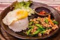 Stir-fried basil or Pad Kra Pao with fried eggs and fish sauce chili is a popular Thai food Royalty Free Stock Photo