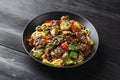 Stir fried beef in black bean sauce with vegetables and noodles. Take away food Royalty Free Stock Photo