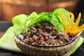 Stir fried beef with oysters, sauce and lettuce in bamboo basket Royalty Free Stock Photo