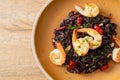 Stir-fried black spaghetti with garlic and shrimps Royalty Free Stock Photo