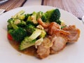 Stir fried broccoli with crispy pork Royalty Free Stock Photo