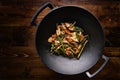 Stir fried chicken in cast iron wok Royalty Free Stock Photo