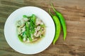 Stir Fried Chicken with green pepper on wood background