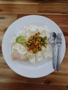 Stir-fried chicken with roasted curry paste and sweet basil leaf, lentils mixed vegetables, Fried egg on jasmine rice in white Royalty Free Stock Photo