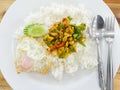 Stir-fried chicken with roasted curry paste and sweet basil leaf, lentils mixed vegetables, Fried egg on jasmine rice in white Royalty Free Stock Photo