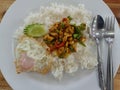 Stir-fried chicken with roasted curry paste and sweet basil leaf, lentils mixed vegetables, Fried egg on jasmine rice in white Royalty Free Stock Photo