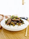 Stir-fried of chicken with zucchini in plate on wooden board Royalty Free Stock Photo