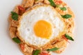 Stir Fried Chili Paste Chicken with Rice Fried eggs in white plate