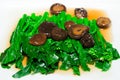 Stir-fried chinese broccoli and shiitake mushroom Royalty Free Stock Photo