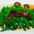 Stir-fried chinese broccoli and shiitake mushroom Royalty Free Stock Photo