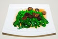 Stir-fried chinese broccoli and shiitake mushroom Royalty Free Stock Photo