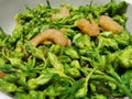 Stir fried cowslip creeper flowers with dried shrim