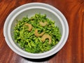 Stir fried cowslip creeper flowers with dried shrim