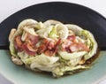 Stir-fried Crisphead lettuce with bacon Royalty Free Stock Photo