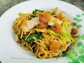 Stir fried egg noodle with dried shrim, pork and vegetable