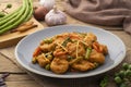 Spicy stir fry clown featherback fishball with sting bean with Thai curry paste Royalty Free Stock Photo