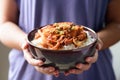 Korean food,Stir fried kimchi with pork on cooked rice Royalty Free Stock Photo