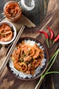 Korean food,Stir fried kimchi with pork on cooked rice Royalty Free Stock Photo