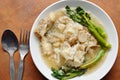 Stir fried large noodle with bass fish and Chinese kale in gravy sauce on plate Royalty Free Stock Photo