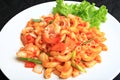 Stir-fried Macaroni with Seafood with Tomato Cream Sauce on white plate, Royalty Free Stock Photo