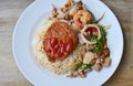 Stir fried mixed seafood with sweet long chili and deep fried pork on rice