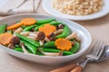 Stir fried mixed vegetables on plate and brown rice, Vegetarian Royalty Free Stock Photo