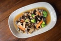 Stir fried mushroom with broccoli carrot vegetable, shiitake mushrooms with oyster sauce cooking food on white plate, shiitake Royalty Free Stock Photo