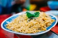 Stir fried noodle with shiitake on plate serve in restaurant at china town in Thailand. Selective focusing