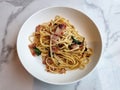 Stir-fried pasta linguine with dried chili and crispy bacon Royalty Free Stock Photo