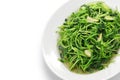 Stir fried pea shoots with garlic Royalty Free Stock Photo