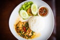 Stir-fried pork with basil and rice with chopped chili in fish sauce