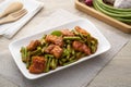 Stir fried pork belly and red curry paste with sting bean Royalty Free Stock Photo