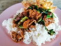 Stir fried pork curry and vegetable with fied egg, spicy Thai food