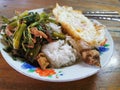 Stir fried pork curry and vegetable with fied egg, spicy Thai food